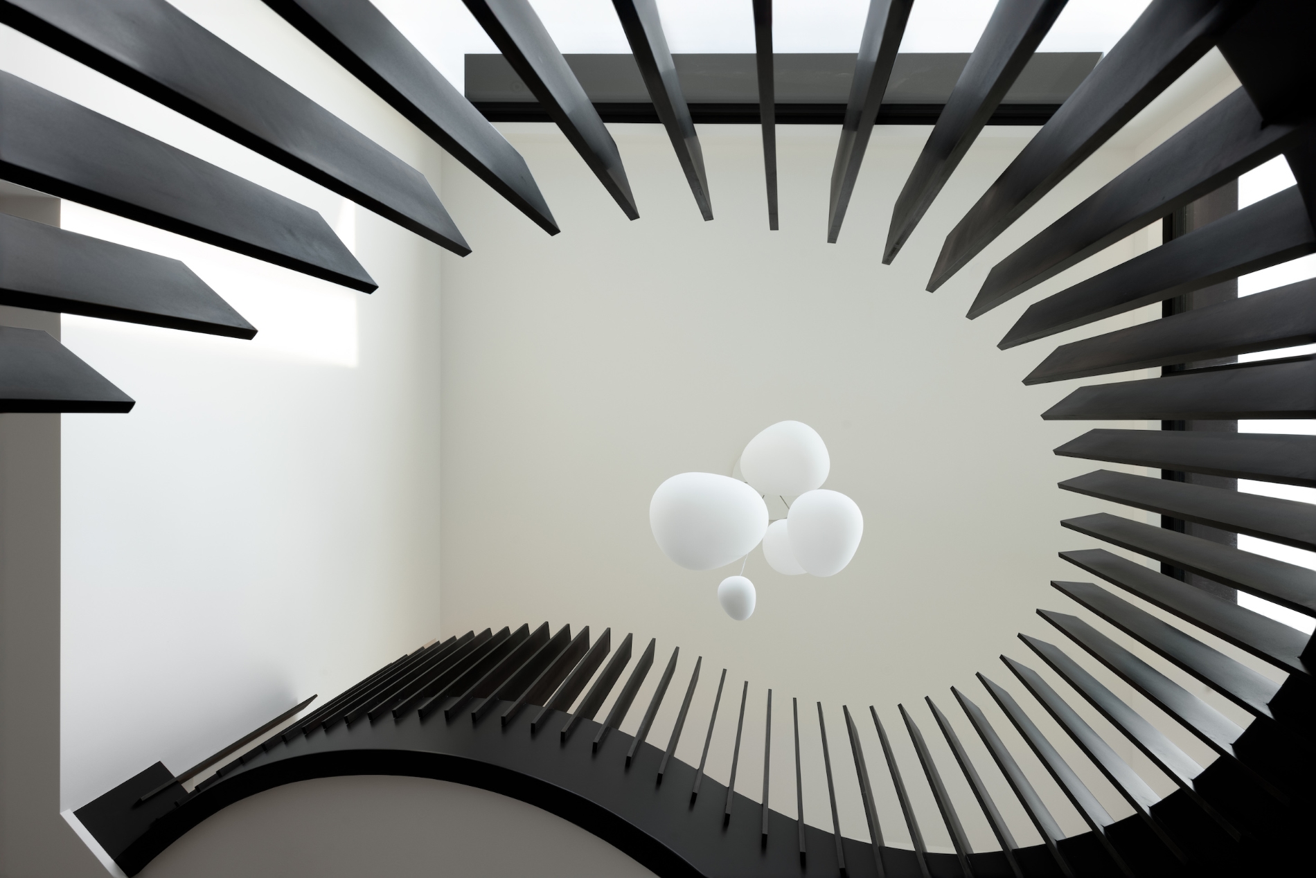 Broadwell Metal looking upwards at rounded staircase railings